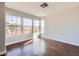 Bright bedroom with hardwood floors, large windows, and recessed lighting at 3558 Harbor Tides St, Las Vegas, NV 89147