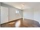 Empty bedroom with hardwood floors, natural light and a neutral color palette at 3558 Harbor Tides St, Las Vegas, NV 89147