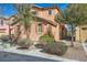 Charming two-story home with a desert landscape, shutters, and an attached garage at 3558 Harbor Tides St, Las Vegas, NV 89147