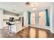 Bright kitchen featuring stainless steel appliances, granite counters, and a center island with barstool seating at 3558 Harbor Tides St, Las Vegas, NV 89147