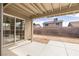 View of covered patio and spacious backyard with block wall for added privacy at 3853 Kellogg Ave, Las Vegas, NV 89115