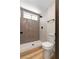 Modern bathroom with a tile shower, light wood-look flooring, and new commode at 3853 Kellogg Ave, Las Vegas, NV 89115