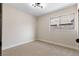 Bright bedroom features neutral carpet, natural light from a window, and modern light fixture at 3853 Kellogg Ave, Las Vegas, NV 89115