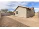 Exterior view of home's backyard, showing covered patio and block wall fencing at 3853 Kellogg Ave, Las Vegas, NV 89115