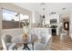 Eat-in kitchen featuring a breakfast bar, stainless appliances, and bright white cabinets at 3853 Kellogg Ave, Las Vegas, NV 89115