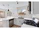 Stylish kitchen featuring stainless appliances, quartz counters, and tiled backsplash at 3853 Kellogg Ave, Las Vegas, NV 89115