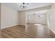 Open concept living room with hardwood flooring and modern lighting at 3853 Kellogg Ave, Las Vegas, NV 89115