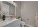 Stylish half bathroom featuring a white vanity, modern fixtures, and neutral decor at 395 W Cox Ave, Overton, NV 89040