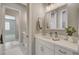 Charming bathroom featuring double vanity, framed mirror, and white bath mats at 395 W Cox Ave, Overton, NV 89040