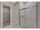 Modern bathroom features white subway tile shower and pebble stone flooring at 395 W Cox Ave, Overton, NV 89040