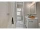 Well-lit bathroom features white subway tile shower and single sink vanity at 395 W Cox Ave, Overton, NV 89040