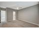 Spacious carpeted bedroom featuring a ceiling fan and ensuite bath at 395 W Cox Ave, Overton, NV 89040