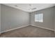 Bright carpeted bedroom features a window with blinds and ceiling fan at 395 W Cox Ave, Overton, NV 89040