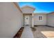 Close up view of a charming front door with desert landscaping at 395 W Cox Ave, Overton, NV 89040