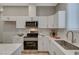 Close up of a kitchen with stainless appliances and white cabinets at 395 W Cox Ave, Overton, NV 89040