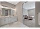 Modern bathroom featuring dual vanities and a view into the main bedroom at 395 W Cox Ave, Overton, NV 89040