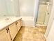 Bright bathroom featuring a soaking tub and a glass-enclosed shower at 4508 W Lake Mead Blvd # 202, Las Vegas, NV 89108