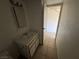 Bathroom with single sink vanity, mirror, and tile flooring at 4770 Topaz St # 31, Las Vegas, NV 89121