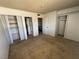 Bedroom featuring carpeting, closet space, and views into the attached bathroom and the top of the staircase at 4770 Topaz St # 31, Las Vegas, NV 89121