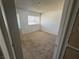 Bedroom featuring natural light, carpet, a closet, and access to an attached bathroom at 4770 Topaz St # 31, Las Vegas, NV 89121