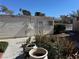 Community building with desert landscaping, plants in pots, and secured entrance at 4770 Topaz St # 31, Las Vegas, NV 89121