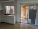 View of the kitchen area with a sliding glass door to an enclosed outdoor patio at 4770 Topaz St # 31, Las Vegas, NV 89121