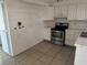 Modest kitchen with stainless steel stove and white cabinetry at 4770 Topaz St # 31, Las Vegas, NV 89121