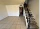 Living area with tile floors, staircase and entry way at 4770 Topaz St # 31, Las Vegas, NV 89121