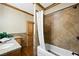 Nicely tiled bathroom with a shower and bathtub, granite counters and wood cabinets at 4888 Snow White Rd, Las Vegas, NV 89124