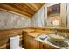 Charming bathroom with decorative sink, and wood paneled ceiling and walls at 4888 Snow White Rd, Las Vegas, NV 89124