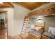 Bedroom with built-in wooden bunk bed and ladder, accompanied by seating at 4888 Snow White Rd, Las Vegas, NV 89124