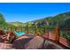 Wide deck area with lounge chairs and a picturesque mountain view backdrop at 4888 Snow White Rd, Las Vegas, NV 89124