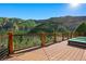 Wide deck area with lounge chairs and a picturesque mountain view backdrop at 4888 Snow White Rd, Las Vegas, NV 89124