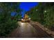 Long stone paved driveway with a home nestled in the middle of the trees at 4888 Snow White Rd, Las Vegas, NV 89124