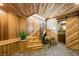 Hallway features wooden ceiling, staircase, and a decorative sliding barn door with a bathroom sink at 4888 Snow White Rd, Las Vegas, NV 89124