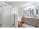 Well-lit bathroom featuring a glass-enclosed shower, vanity with sink, and neutral color palette at 502 Fragrant Orchard St, Henderson, NV 89015