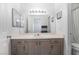 Functional bathroom with a large mirror, vanity, and neutral decor at 502 Fragrant Orchard St, Henderson, NV 89015