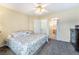 Spacious bedroom leads to a bathroom and features neutral walls, a ceiling fan, and a cozy atmosphere at 502 Fragrant Orchard St, Henderson, NV 89015