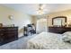 Well-lit bedroom with a desk, dresser, and comfortable bed, perfect for relaxation and productivity at 502 Fragrant Orchard St, Henderson, NV 89015