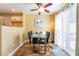 Eat-in dining room featuring a modern table, ceiling fan and sliding glass doors to the patio at 502 Fragrant Orchard St, Henderson, NV 89015