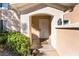 Inviting townhouse entrance featuring a secure gate and meticulously kept landscaping at 502 Fragrant Orchard St, Henderson, NV 89015