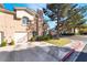 Two-story townhouse featuring a garage and inviting curb appeal at 502 Fragrant Orchard St, Henderson, NV 89015