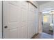 Hallway with closet leading to bedroom featuring neutral carpet and natural light at 502 Fragrant Orchard St, Henderson, NV 89015