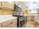 Bright kitchen with stainless steel oven range and microwave at 502 Fragrant Orchard St, Henderson, NV 89015