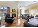 Inviting living room with fireplace, plush seating, and large windows for natural light at 502 Fragrant Orchard St, Henderson, NV 89015