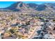 Scenic aerial view of a residential area nestled near a mountain, showcasing the community and surrounding landscape at 52 Vallejo Verde St, Henderson, NV 89012