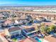 Expansive aerial view of a suburban neighborhood with mountain views, pools, and well-maintained landscaping at 52 Vallejo Verde St, Henderson, NV 89012