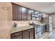 Well-equipped kitchen featuring stainless steel appliances and beautiful granite countertops at 52 Vallejo Verde St, Henderson, NV 89012