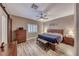 Comfortable main bedroom with a ceiling fan and shuttered windows at 52 Vallejo Verde St, Henderson, NV 89012