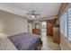 Cozy main bedroom featuring a wood accent door and light-filled windows at 52 Vallejo Verde St, Henderson, NV 89012